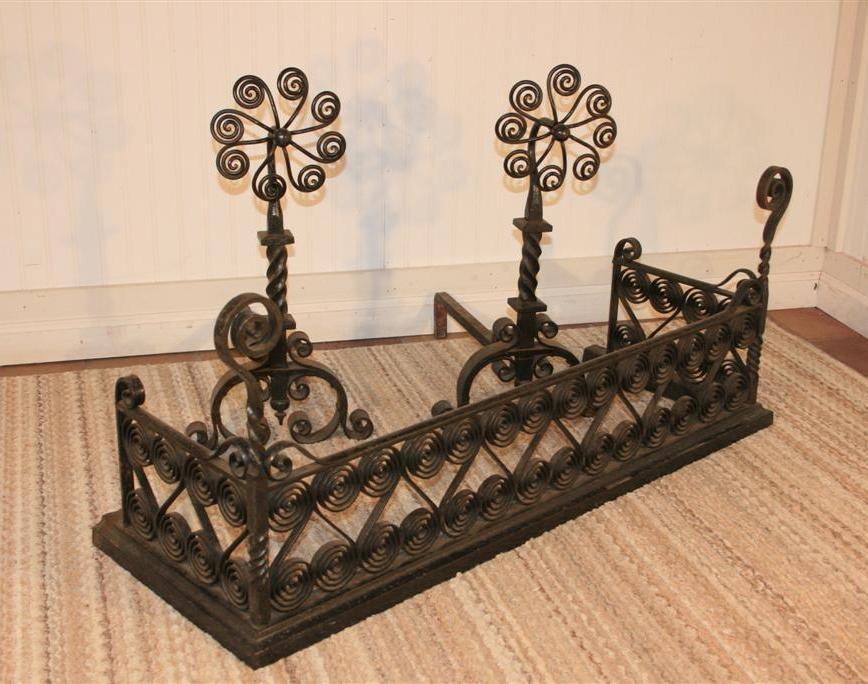 Breathtaking Antique Late 19th - Early 20th Century Arts & Crafts Mantle/Fireplace Set With Scrolled Fireplace Fender and Matching Daisy Form Andirons/Firedogs. This amazing set features hand crafted heavy iron work creating true pieces of art. The
