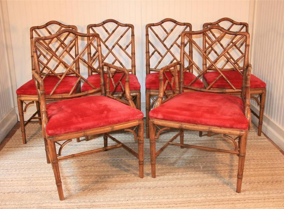 Complete set of 6 Vintage Faux Bamboo Trellis Back Dining Room Chairs consisting of 4 side chairs and 2 Armchairs. Very rare to find a complete set. Large Matching Glass Top Dining Table also available. Sidechairs measure 36.5