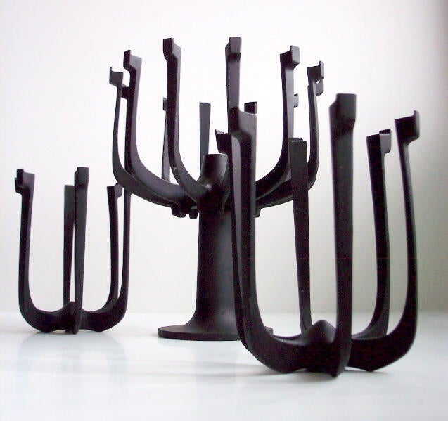 gunmar syren denmark  centerpiece candlesticks
The Swede, Gunnar Cyren was one of several other designers besides Jens Quistgaard that ended up designing for Dansk. Among trivets, plastic pieces 
and pepper grinders, he also created several candle