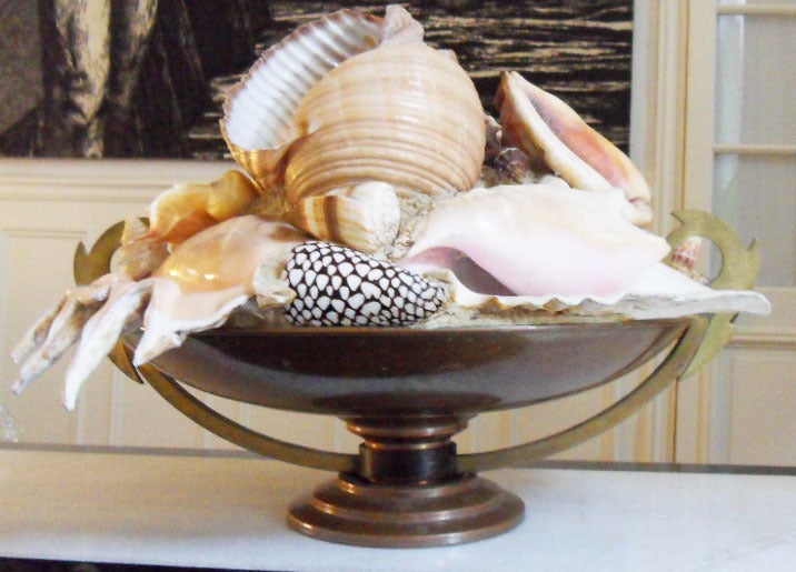 an Italian 1950 Bronze and brass center piece with large shells:
A Fanciful and  decorative Italian circa 1950 Centerpiece,
Made of a brass large bowl  with handles in two tones of  bronze finish,
fitted with various very large shells