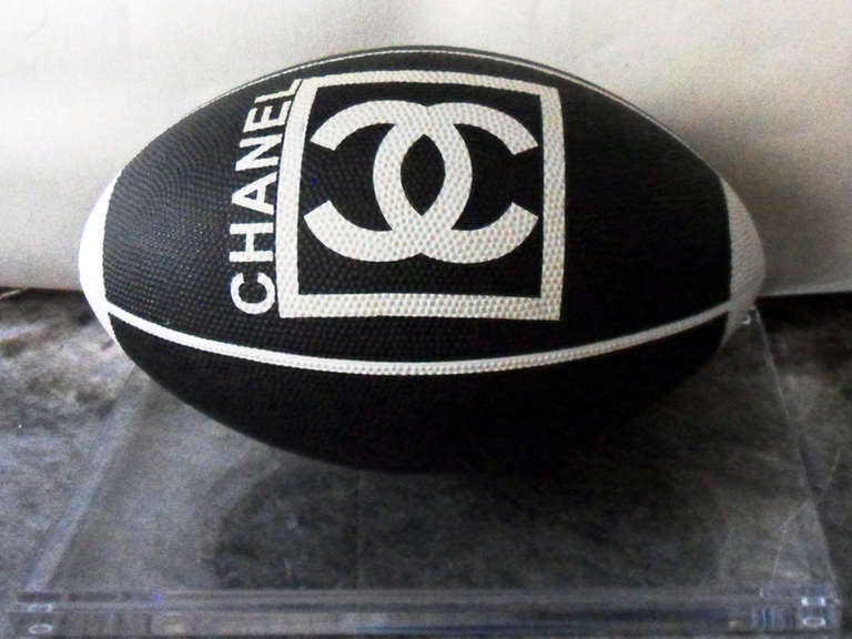 THE 2007  CHANEL GRAINED RUBBER RUGBY BALL ,EDITED FOR  THE WORLD RUGBY CAHMPIONSHIP-
The combination of rugby and Chanel seem as disparate as can be, yet the creative genius' at Chanel have come up with something tremendously chic. Their rugby