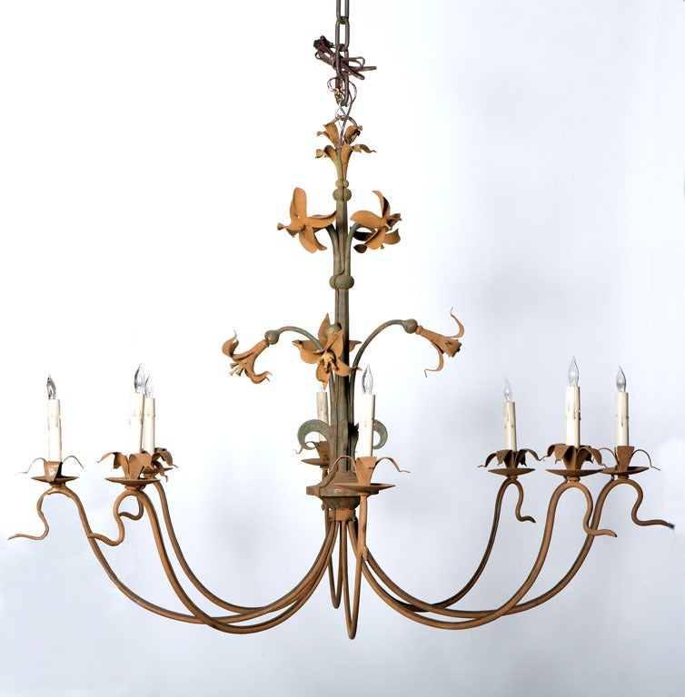 Iron, late 19th century Lightning Rod, that we have newly added eight arms to, creating a chandelier. Finish is weathered green, with mustard colored flowers, and arms are an aged brown patina.