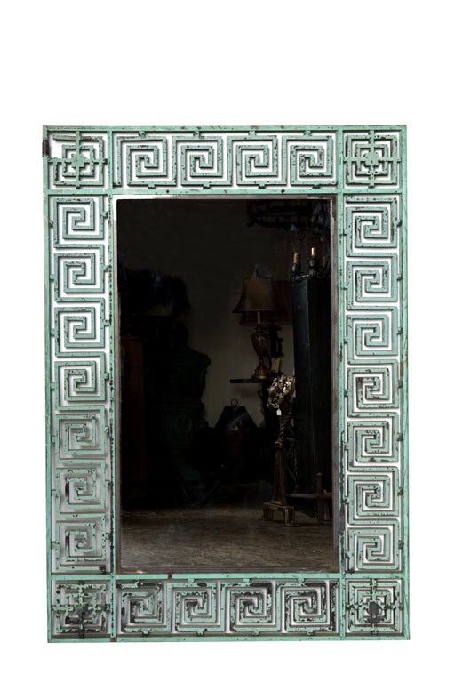 Cast Bronze greek key design. These bronze pieces were originally gates, that have been newly modified with an inner iron frame with new mirror glass.