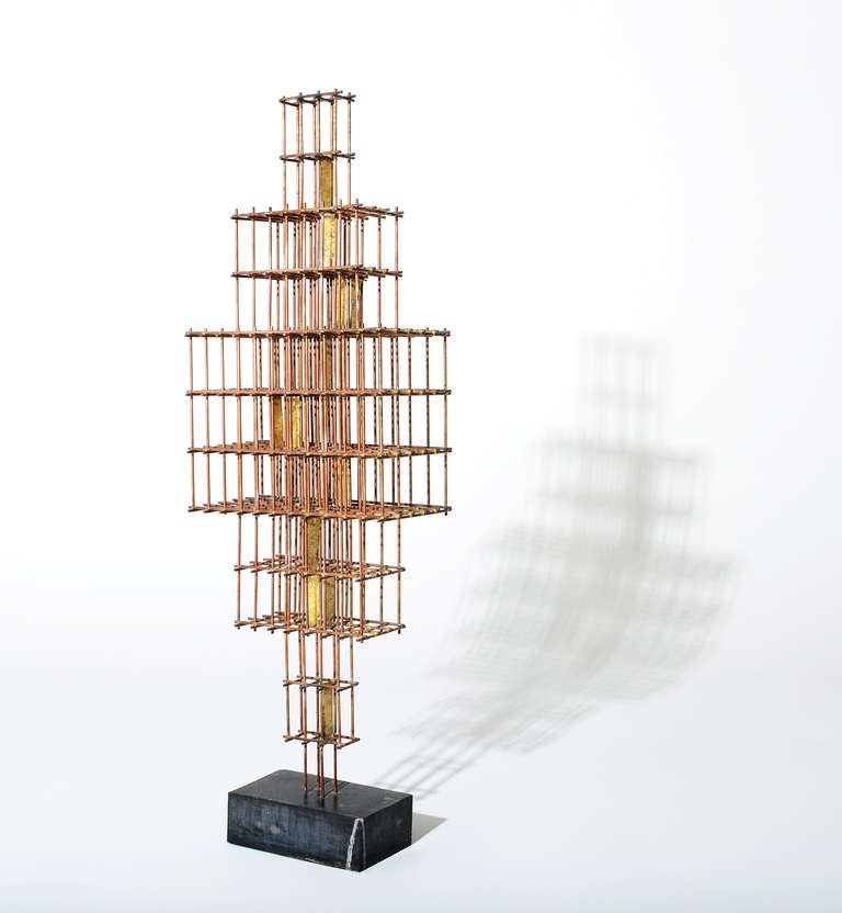 An exceptional sculpture created by C.Jere in 1969.

The scale and quality of this piece are reminiscent of a Harry Bertoia piece.
Hand brazed horizontal and vertical brass rods raised atop a solid black marble base.  Solid rectangles of brass