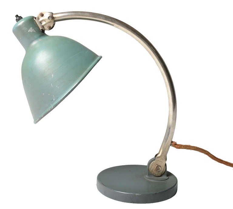 A very early example .   This table lamp by Paavo Tynell for Taito Oy was listed in the 1935 catalogue as Model 5305.
Stamped with Taito Oy AB and 5305 on the base swivel.

This is a terrific early modern lamp with heavy influence by the Bauhaus