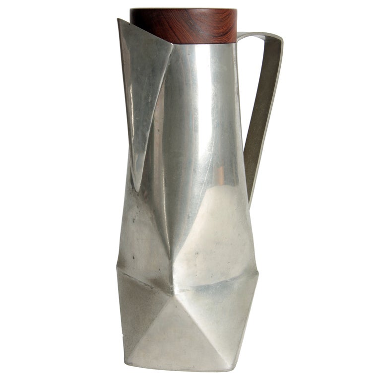 An unusual modernist water pitcher in pewter