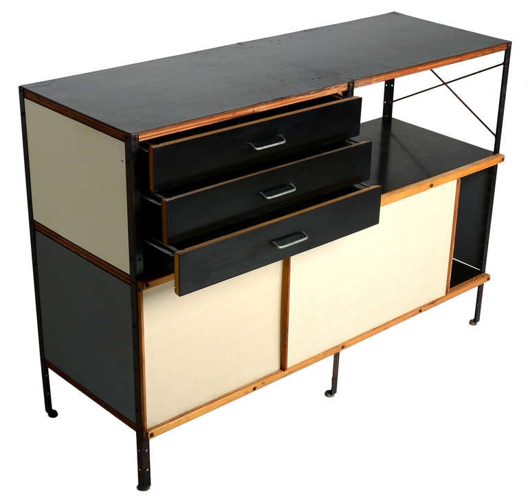 A first year example of the groundbreaking ESU series designed by Charles Eames in 1949.

This example with incredibly rare fibreglass sliding doors and wire-framed sliding drawers.

Exceptional as this example is original in every way.  Never