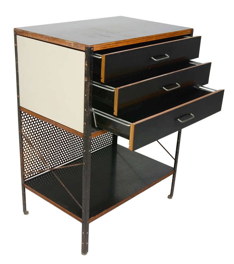An incredibly rare example of the groundbreaking Eames ESU series.

This example is one of the earliest configurations with wire drawer pulls and wire framed drawers.
Black frame with black drawers, black shelves, and black perforated rear