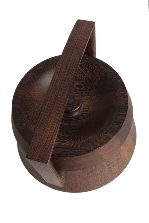 A great solid wenge staved ice bucket by Quistgaard.
Incredible design and form.

Exceptionally well executed with dowels, pin through joinery, dovetails and hand turned work.