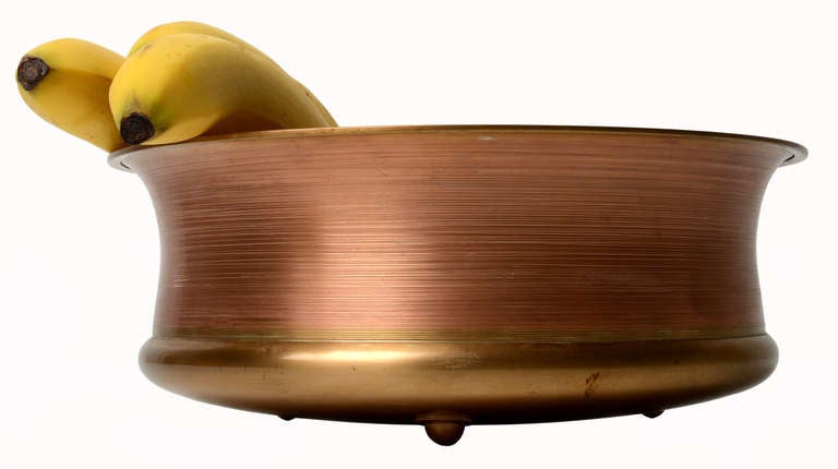 A very nice and rather large solid bronze bowl by Tapio Wirkkala for Kultakeskus Oy, ca. 1974

Sculpted and hand turned with applied bronze feet.

Stamped to bottom .