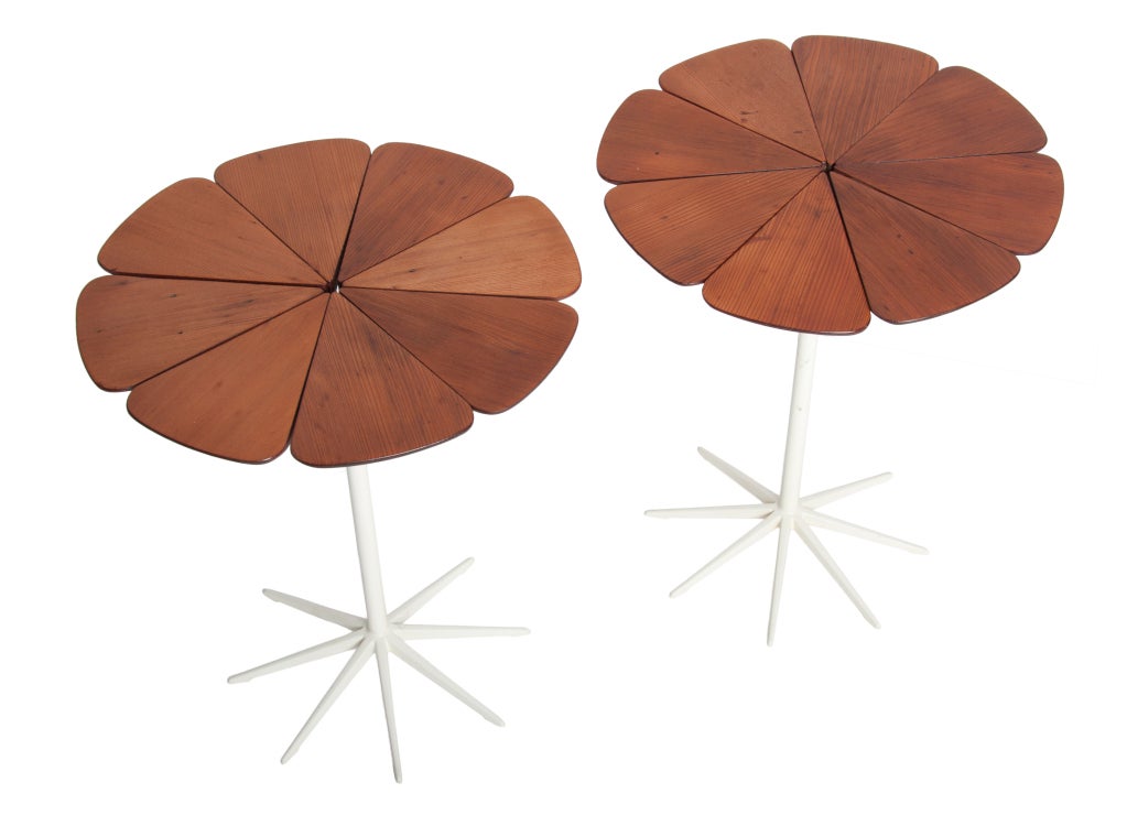 A nice early pair of petal tables in redwood .