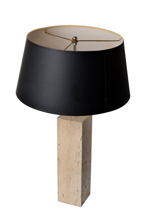 A nice travertine based table lamp.  Simple elegance.
A travertine base with chromed central column.