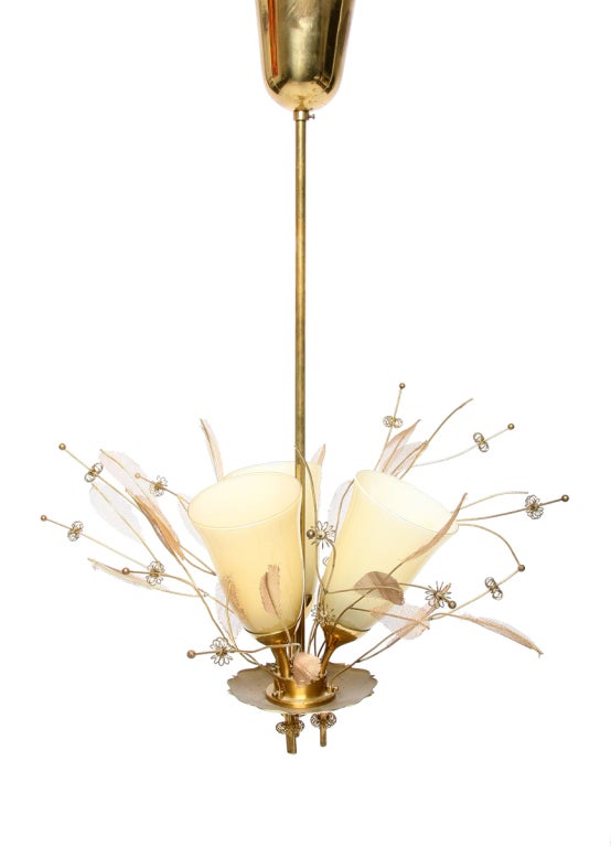 A beautiful three arm chandelier by Paavo Tynell for Taito Oy Finland.
