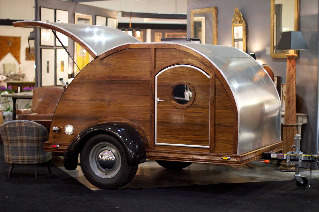 Reproduction mahogany teardrop party trailer. The design combines elements of a Chris Craft Boat, a Mini Airstream and a Paris Bistro Bar - three of our favorite things! The interior is the size of a double bed and so light it can be pulled by a