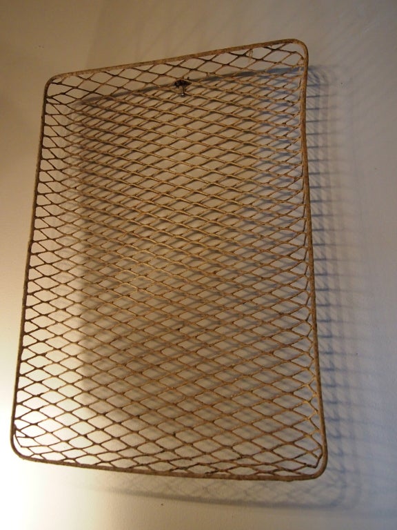 These sturdy wire trays were used in a turn of the century french factory. Would be great to hold boots in a mudroom or plants in a potting shed. 15 available. Priced individually.