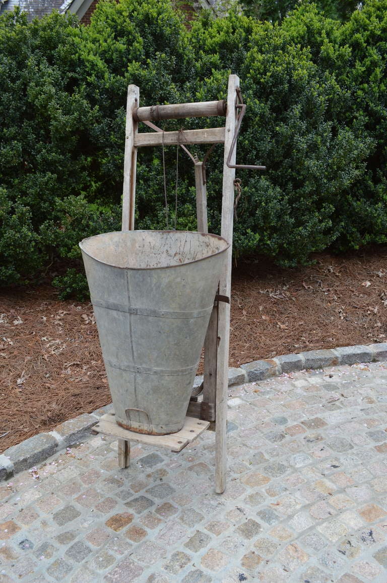 Unusual antique grape hod and winch used in french vineyards to hoist picked grapes. Would make a great addition to a wine cellar or garden room.