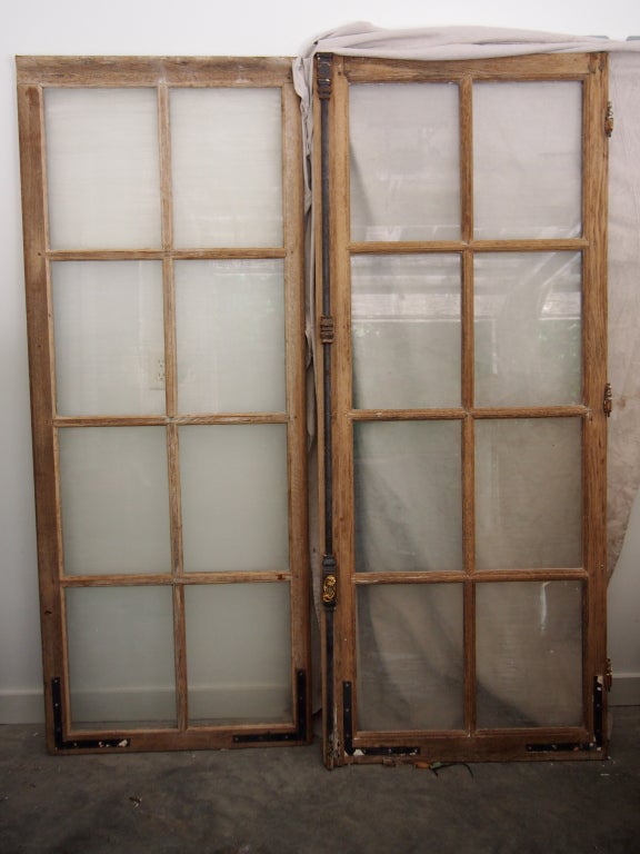 19th c. French Window with gilt iron cremon bolt. It appears to have been painted and stripped at one time. Original glass and partial hardware.