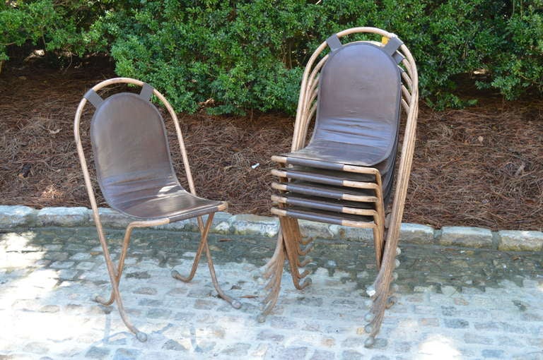 Six very unusual Mid-Century English leather and steel stacking chairs by Sebel. Sebel Products traded from New Oxford Street in London and exhibited these chairs at The British Industries Fair in 1947. Excellent condition.