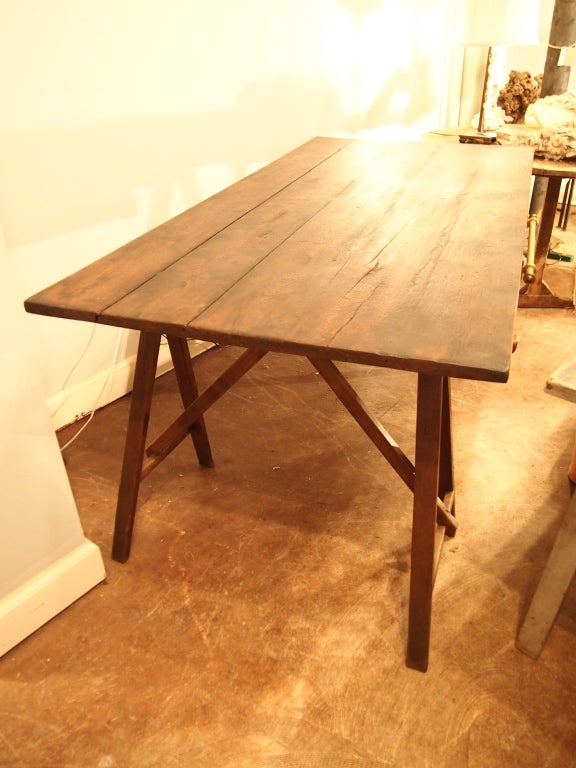 Antique oak trestle table with recent brass hardware