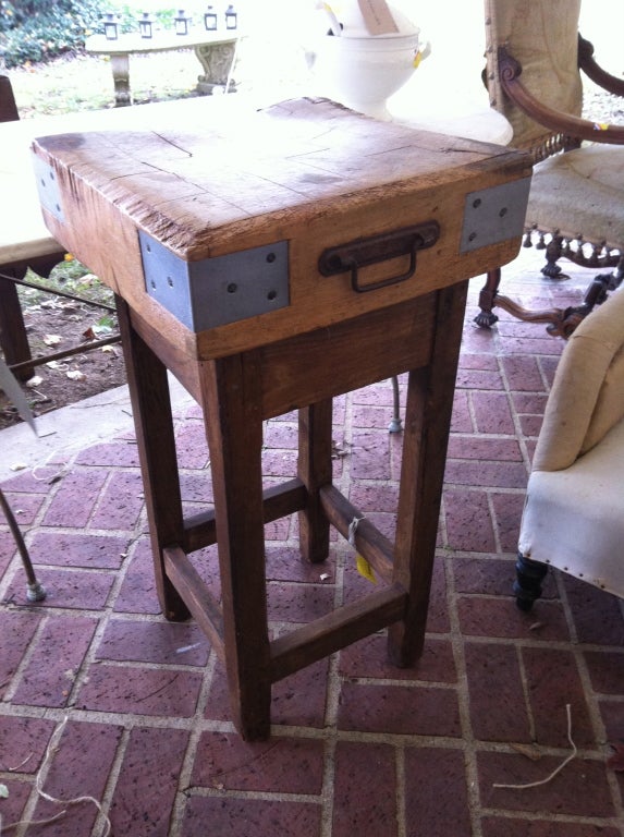 Small Butcher's block with handle was carried by the butcher to market. Stand is not attached for portability. It is in original condition with some cracks in the butcher top and small chips- see all photos