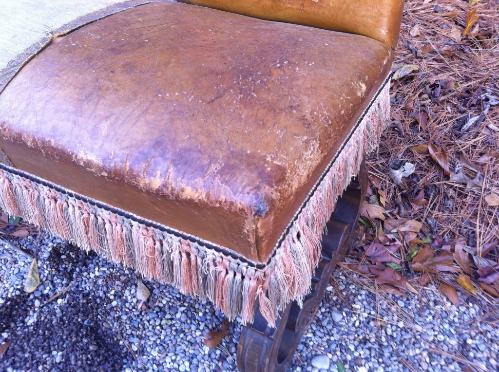 French Leather settee with Carved base and tassel fringe In Good Condition In Nashville, TN