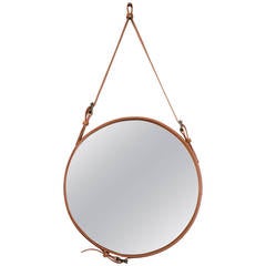 A leather Adnet style mirror .