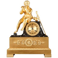 Bronze figural mantel clock with a shepherd playing the flute signed Otran Fils
