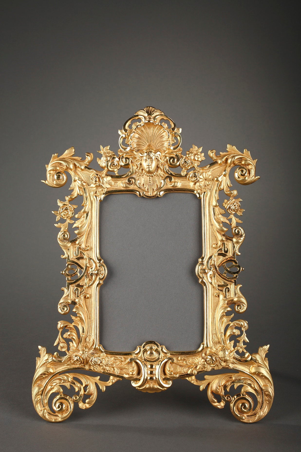 Louis XV style gilt bronze frame with mascaron and foliage For Sale