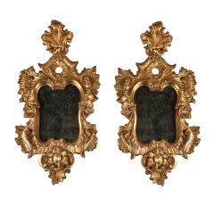 Pair of 18th Century Venetian gilt and sculpted wood mirrors