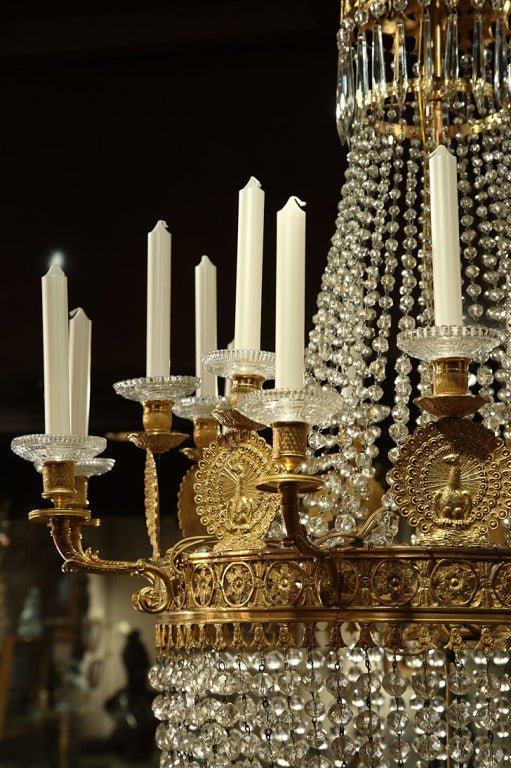 20th Century A French First Empire crystal and ormolu peacock decorated chandelier For Sale