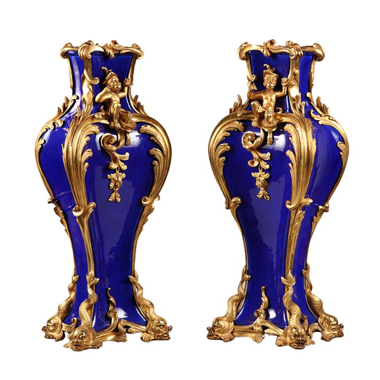 A pair of Louis XV style ormolu mounted blue porcelain vases For Sale