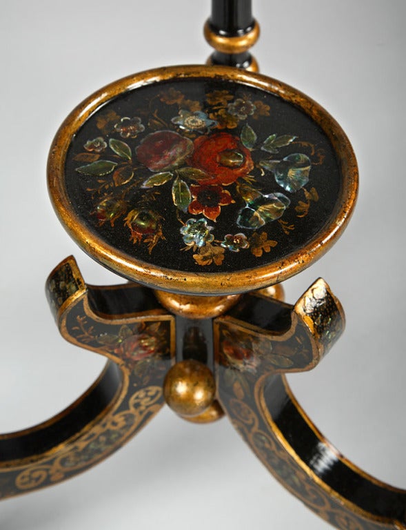 A wood and papier mache black lacquered dressing table with an oval mirror,all inlaid with mother of pearl, and hand-painted with flowers and gilded patterns. Come with its full set of pink opaline glass comprising in particular a large basin and an
