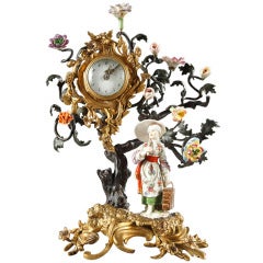 Small clock in porcelain ormolu and patinated bronze in Louis XV