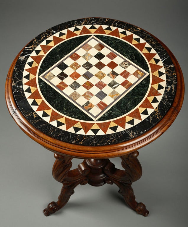 An Italian top marble inlaid resting on a wood sculpted tripod For Sale 1