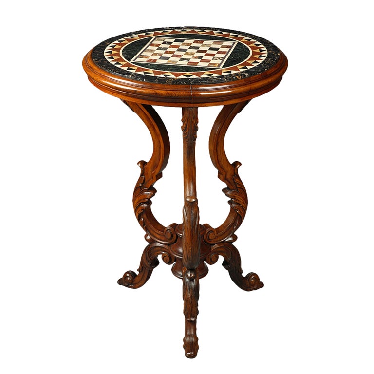 An Italian top marble inlaid resting on a wood sculpted tripod For Sale