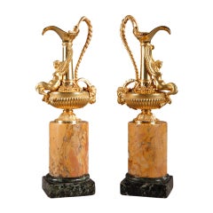 Pair of French ormolu ewers on a sienna marble base