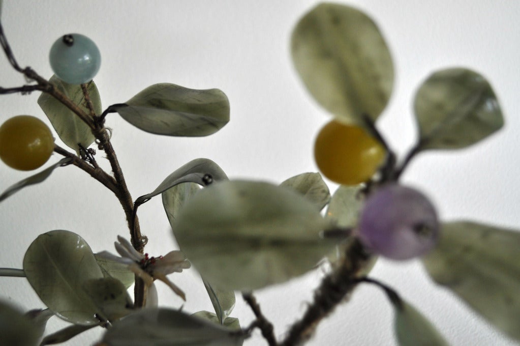 A stunning and outstandingly well conditioned jade tree on stand and spinach jade bowl with green jade leaves with amethyst, jade, yellow jade, and quartz fruit with seed peonies.