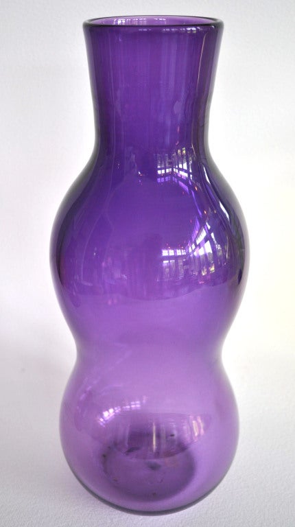 A strong hand blown lavender glass vase by important 20th Century designer Eva Zeisel. Designed and hand blown in Corning NY, 1999. Edition of 6. All signed E. Zeisel, dated, and numbered.