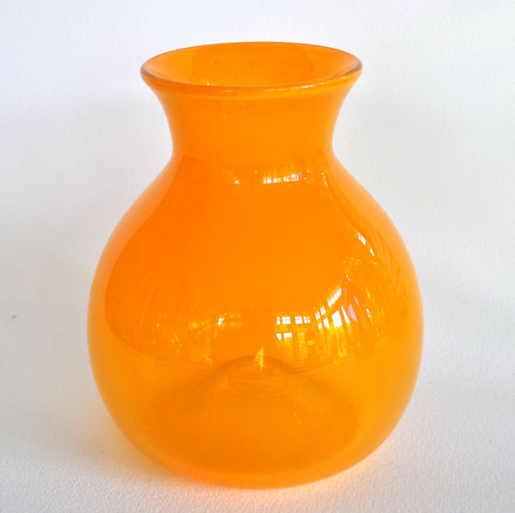 A wonderful small hand blown glass vase by important designer Eva Zeisel. Hand blown in Corning, NY. Each signed E. Zeisel, dated 1999, and numbered 1-6.