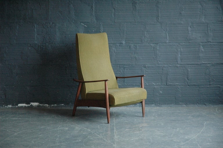 Baughman is one of the original California Craft designers, and is known for his simple and clean designs that have just enough of something extra to make them special. This chair is in the original olive wool upholstery.