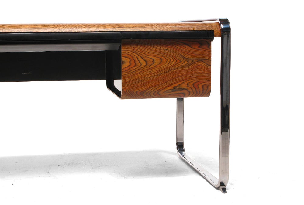 Made in USA by Herman Miller
 
An amazing, rare desk for Herman Miller. Only produced in 1970 and 1971. Beautifully designed, every component is worked into a coherent form including integrated legs, a bent zebrawood surface in great condition,