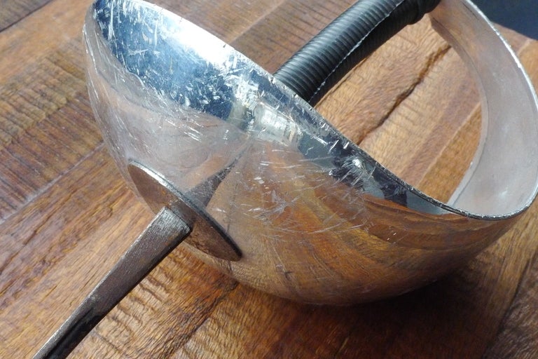 Italian-made vintage sabre.  Curved hand guard and rubber grip.