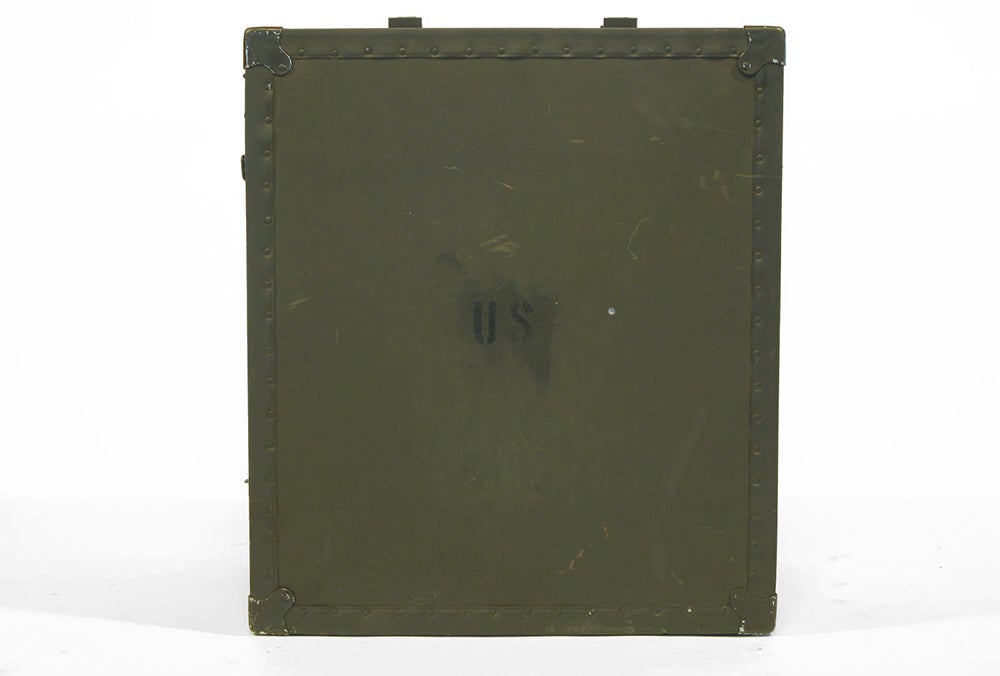An amazing, weathered military surplus field desk from the 1970s. From a travel case, the desk unfolds into a small table and set of drawers with a folding stool. This could make an amazing display case or set piece as well.

Dimensions:
Unfolded