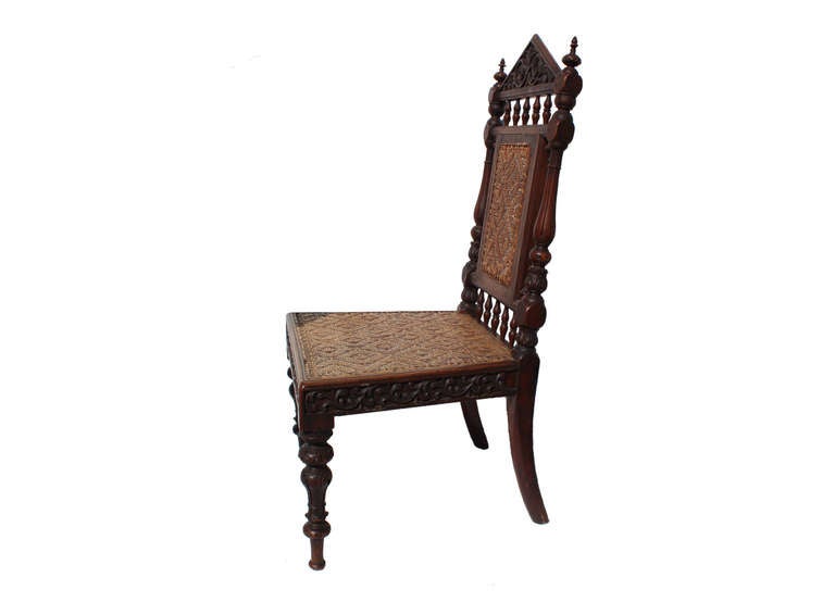 antique portuguese carved side chair with pediment, balusters and a woven seat, circa 1880

minor wear to woven seat consistent with age 

this item must be shipped via third party carrier, please contact rummage for a freight/shipping quote