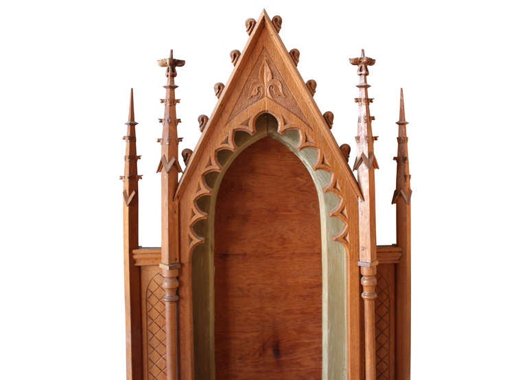 antique gothic carved oak altar with pull out kneeler, locked storage compartment, and drawer. 