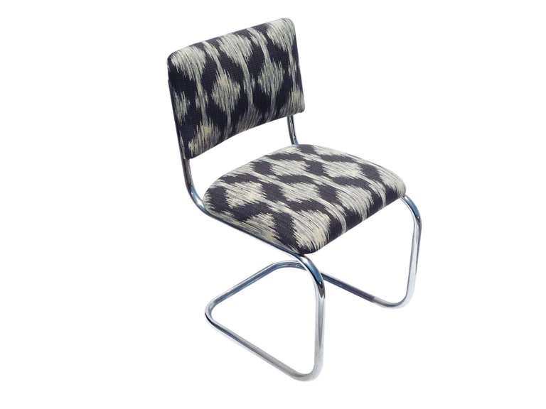 pair of 421 sled base chrome chairs with ikat claremont upholstery.