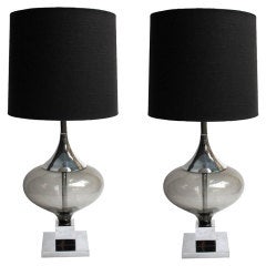 pair of glass and chrome lamps