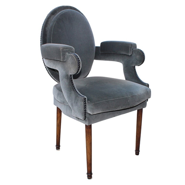 floor model blue velvet upholstered dining chair with nail head trim, has minor blemishes to fabric consistent with gentle use.

priced and available as shown. custom sizing and fabrics available with approximately a 4-6 week lead time, please