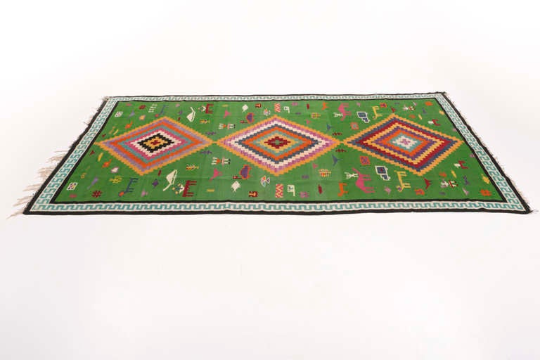 Southern tunisian rug produced nearby Gafsa with typical pixel type motifs.
Signed and dated 