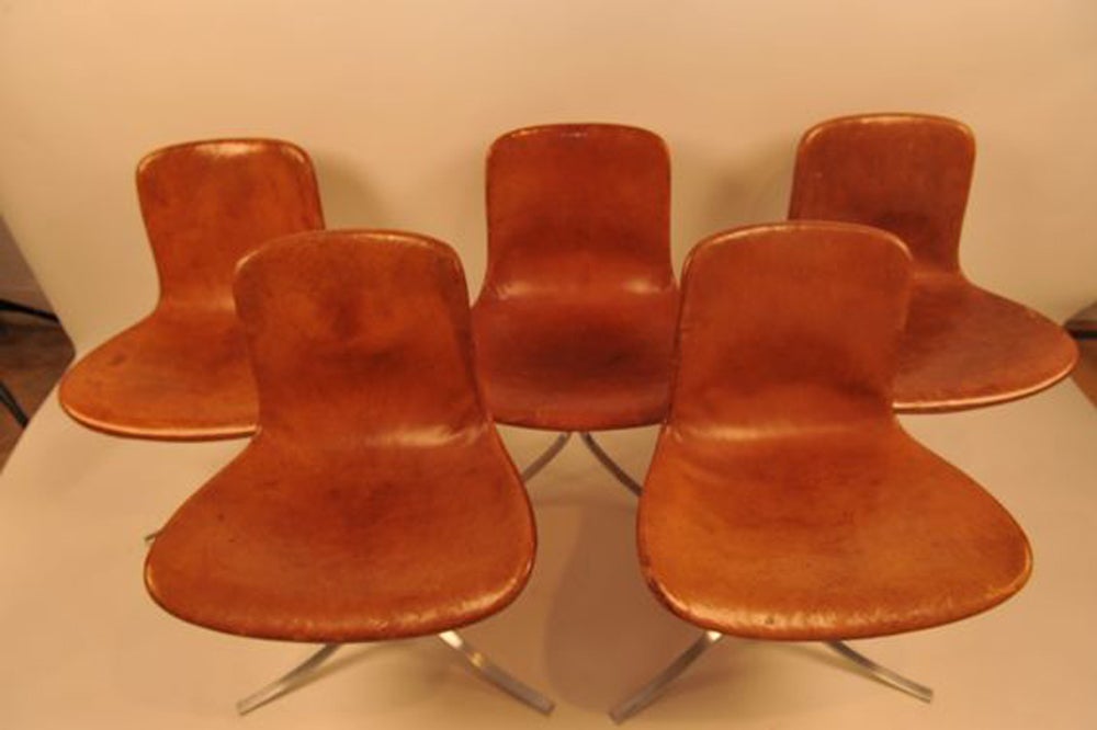 Unique set of eight dining room chairs , model PK-9 by P. Kjaerholm. 1st Edition. E. Kold Christensen production. (logo ; 1960-1981).
Poul Kjaerholm inspired himself from Mies van der Rohe. He worked mainly with metal providing innovative solutions